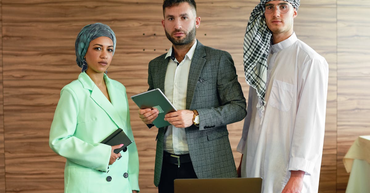 A diverse group of business professionals engaged in a serious office environment.